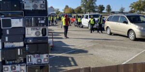 photo of people collecting electronics for recycling at a collection event