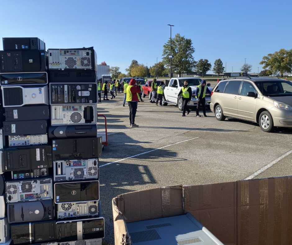 photo of people collecting electronics for recycling at a collection event
