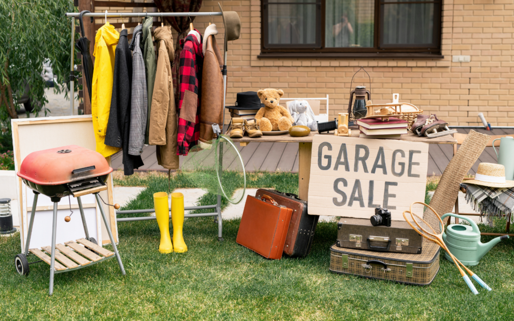 Image of items on a table and rack at a garage sale