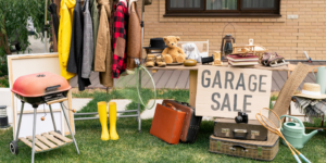 Image of items on a table and rack at a garage sale